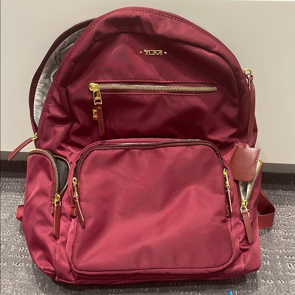 TUMI Maroon Backpack with Gold Details
